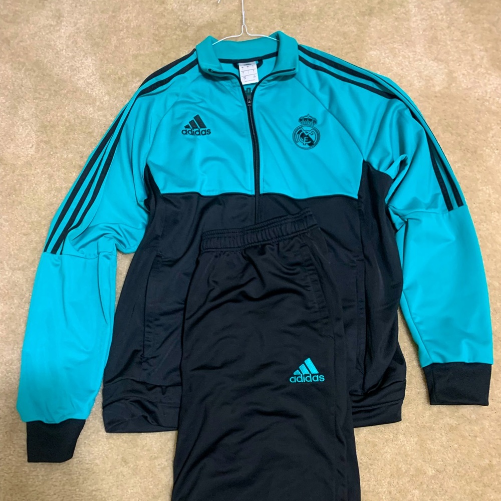 Authentic 2018 Real Madrid Track Suit.  Soft polyester Material.